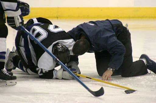 How can I help prevent injuries in my kid while he/she learns to play Hockey?