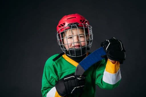 How can I help prevent injuries in my kid while he/she learns to play Hockey?