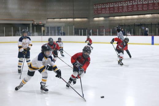 How can I help prevent injuries in my kid while he/she learns to play Hockey?
